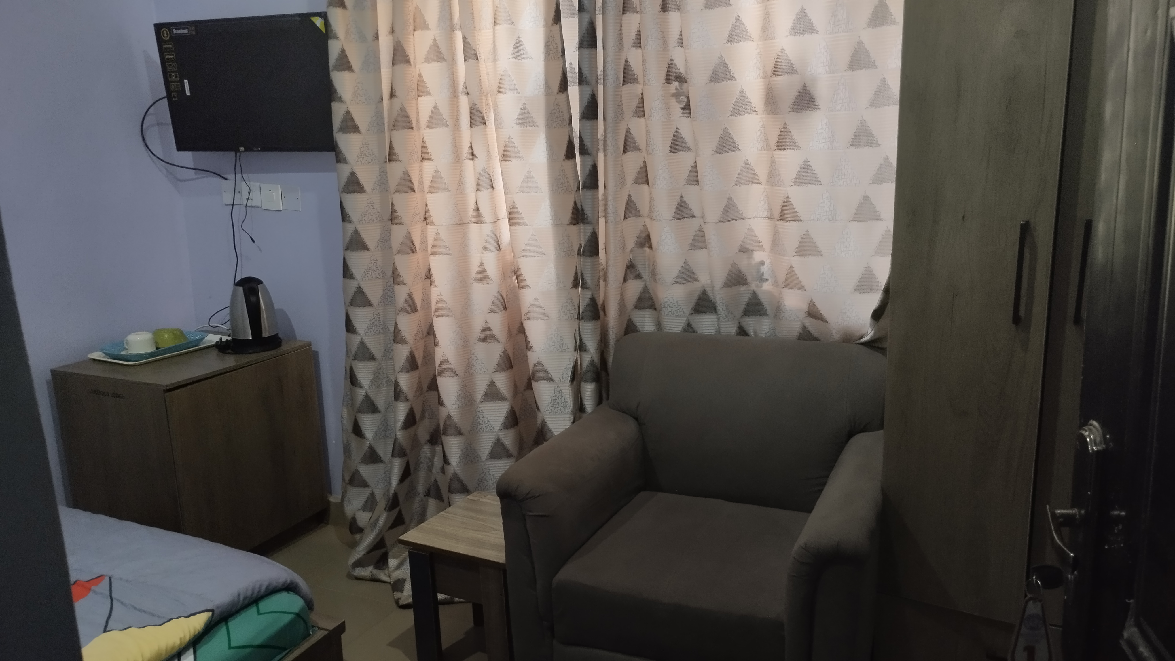 Gracious Lodge room 2 seating area with sofa and TV